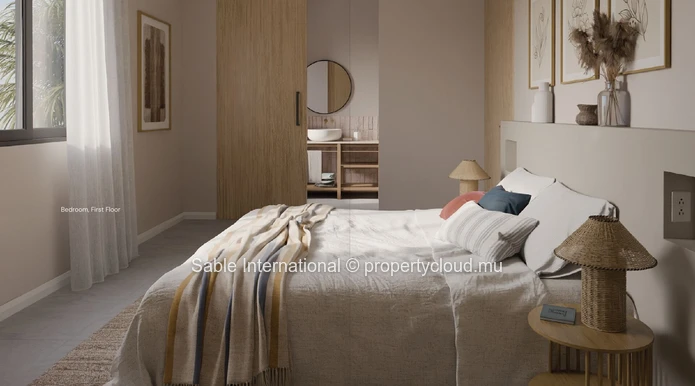 Appartement R+2 à vendre à Trou aux Biches, 122m², piscine commune, climatisé, proche écoles et commerces.
