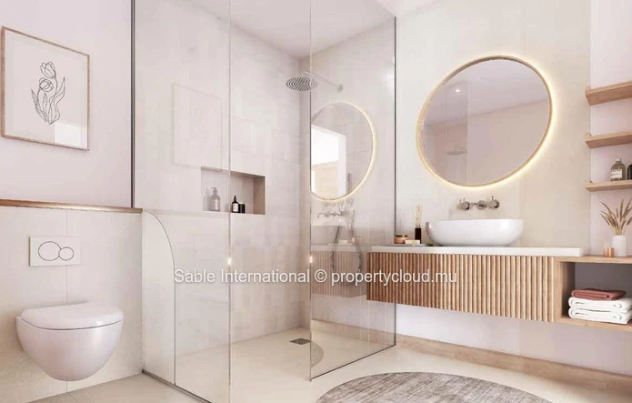 Appartement R+2 à vendre à Péreybère, 118m², 2 chambres, piscine commune, accès mer, proche commodités, cuisine équipée.