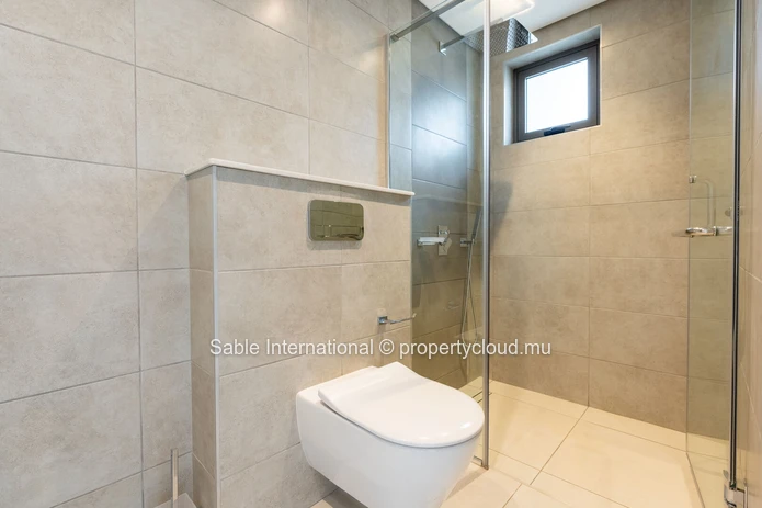 Appartement élégant avec piscine commune à Pointe aux Canonniers - Caractéristiques modernes, proche des commodités