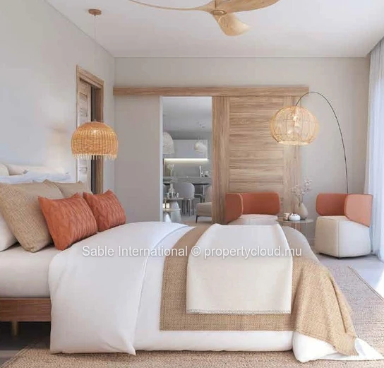 Appartement R+2 à vendre à Péreybère, 118m², 2 chambres, piscine commune, accès mer, proche commodités, cuisine équipée.